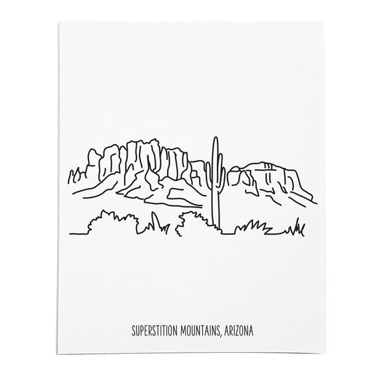 An art print featuring a line drawing of the Superstition Mountains on white linen paper