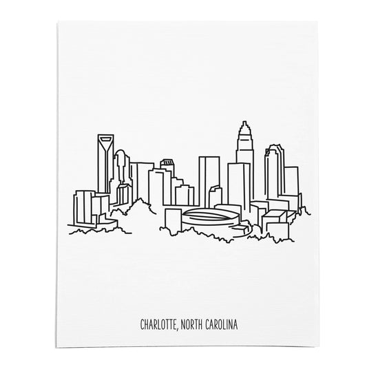 An art print featuring a line drawing of the Charlotte Skyline on white linen paper