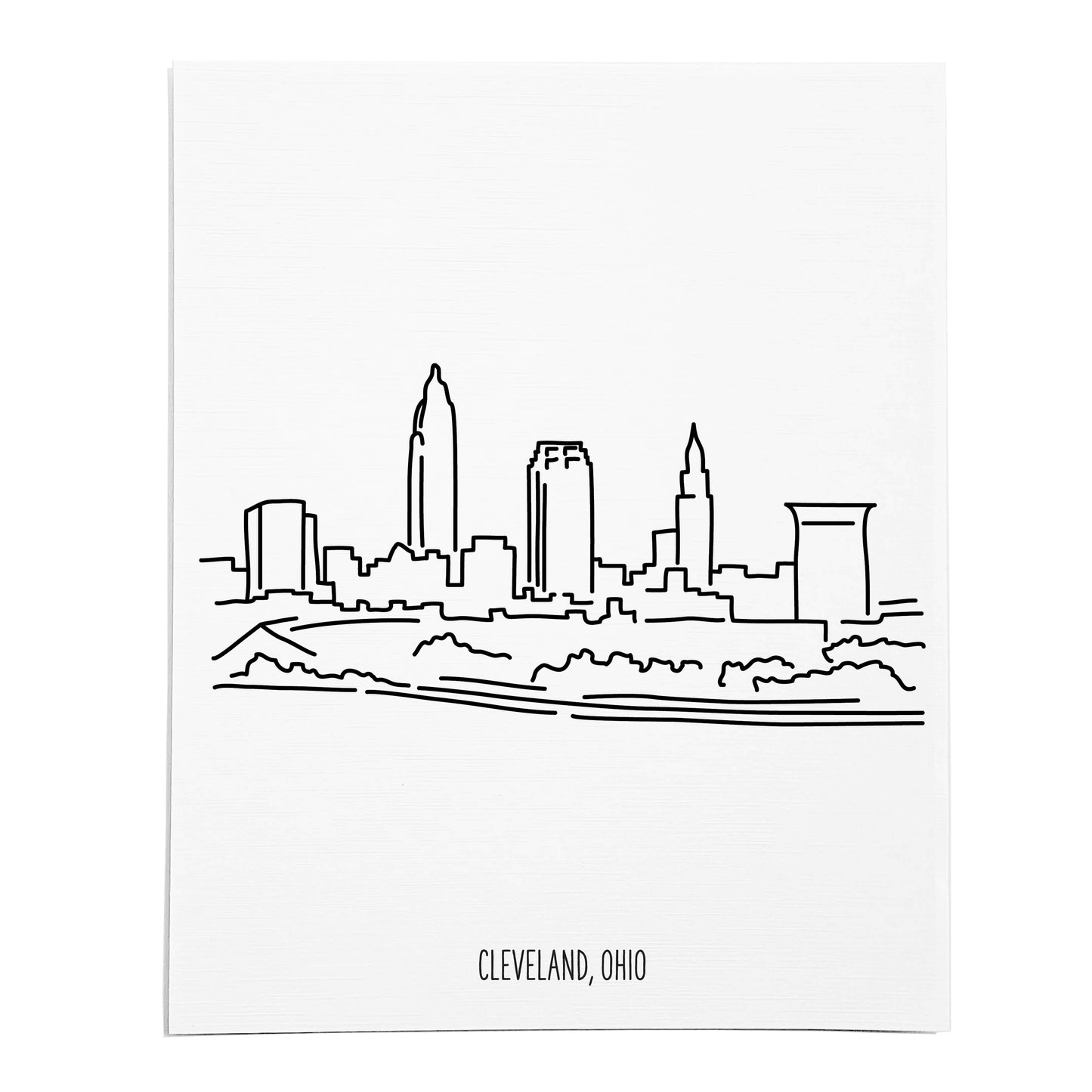 An art print featuring a line drawing of the Cleveland Skyline on white linen paper