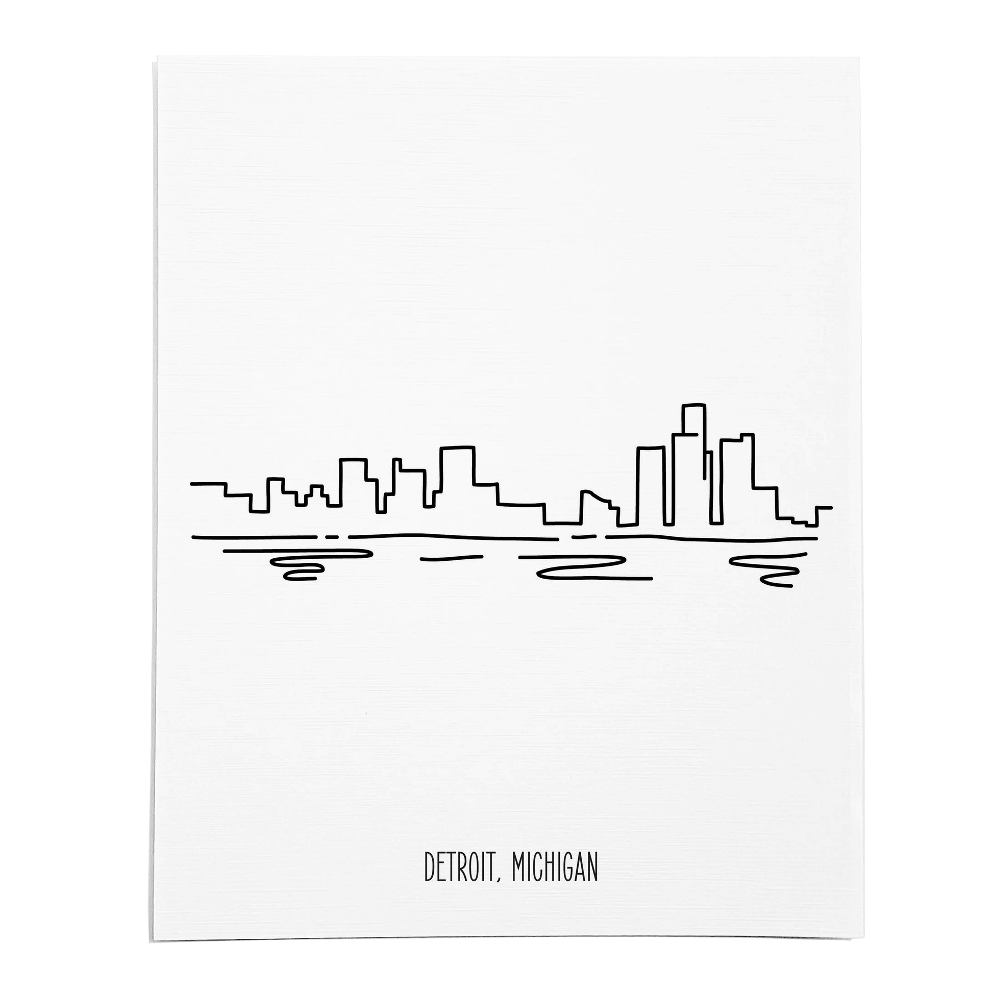 An art print featuring a line drawing of the Detroit Skyline on white linen paper
