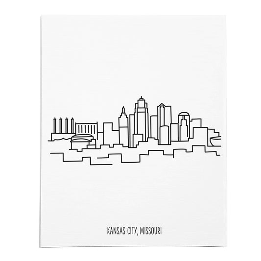 An art print featuring a line drawing of the Kansas City Skyline on white linen paper