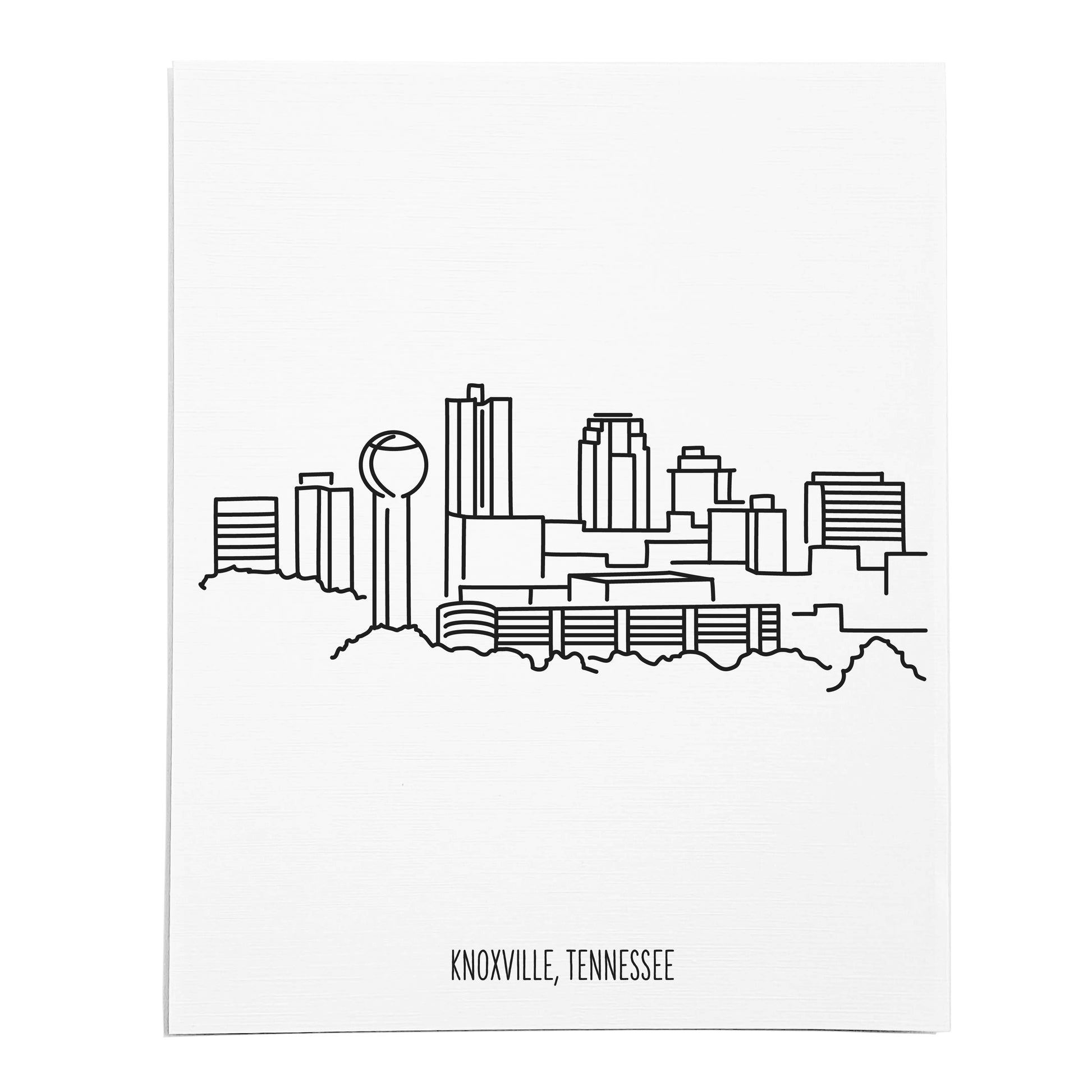 An art print featuring a line drawing of the Knoxville Skyline on white linen paper