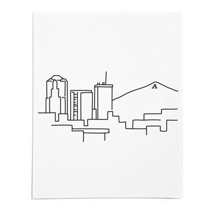 An art print featuring a line drawing of the Tucson Skyline on white linen paper
