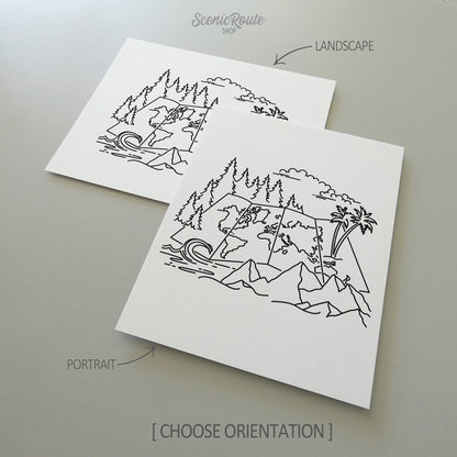 Two line art drawings of the Adventure Map Drawing on white linen paper with a gray background.  The pieces are shown in portrait and landscape orientation for the available art print options.