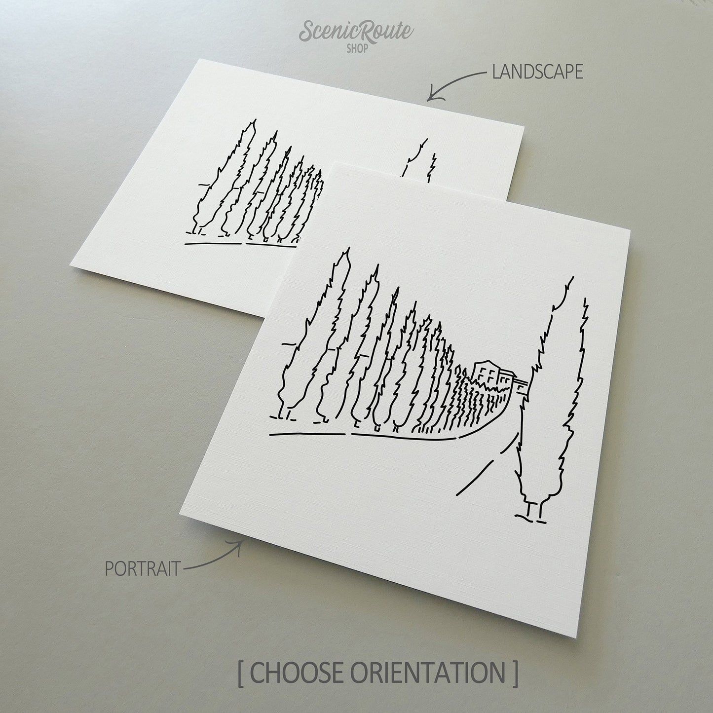 Two line art drawings of a Tuscany Drive on white linen paper with a gray background.  The pieces are shown in portrait and landscape orientation for the available art print options.