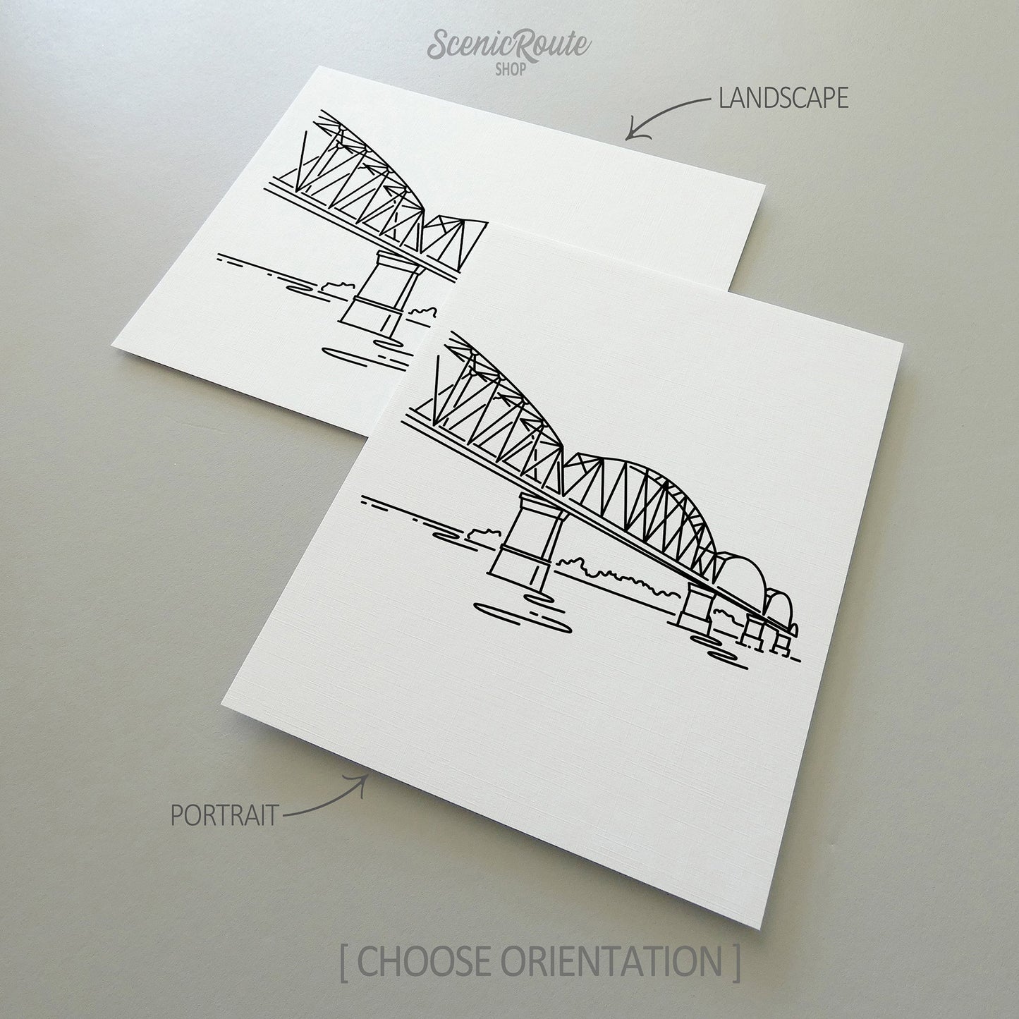 Two line art drawings of the Big Four Bridge on white linen paper with a gray background.  The pieces are shown in portrait and landscape orientation for the available art print options.