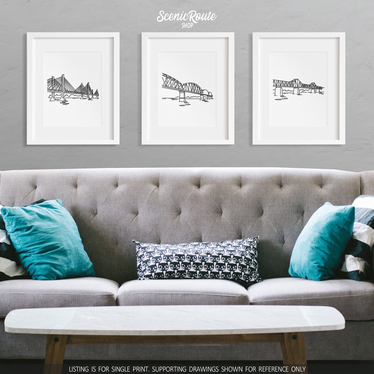 A group of three framed drawings on a wall above a couch. The line art drawings include the Abraham Lincoln Bridge, Big Four Bridge, and Second Street Bridge