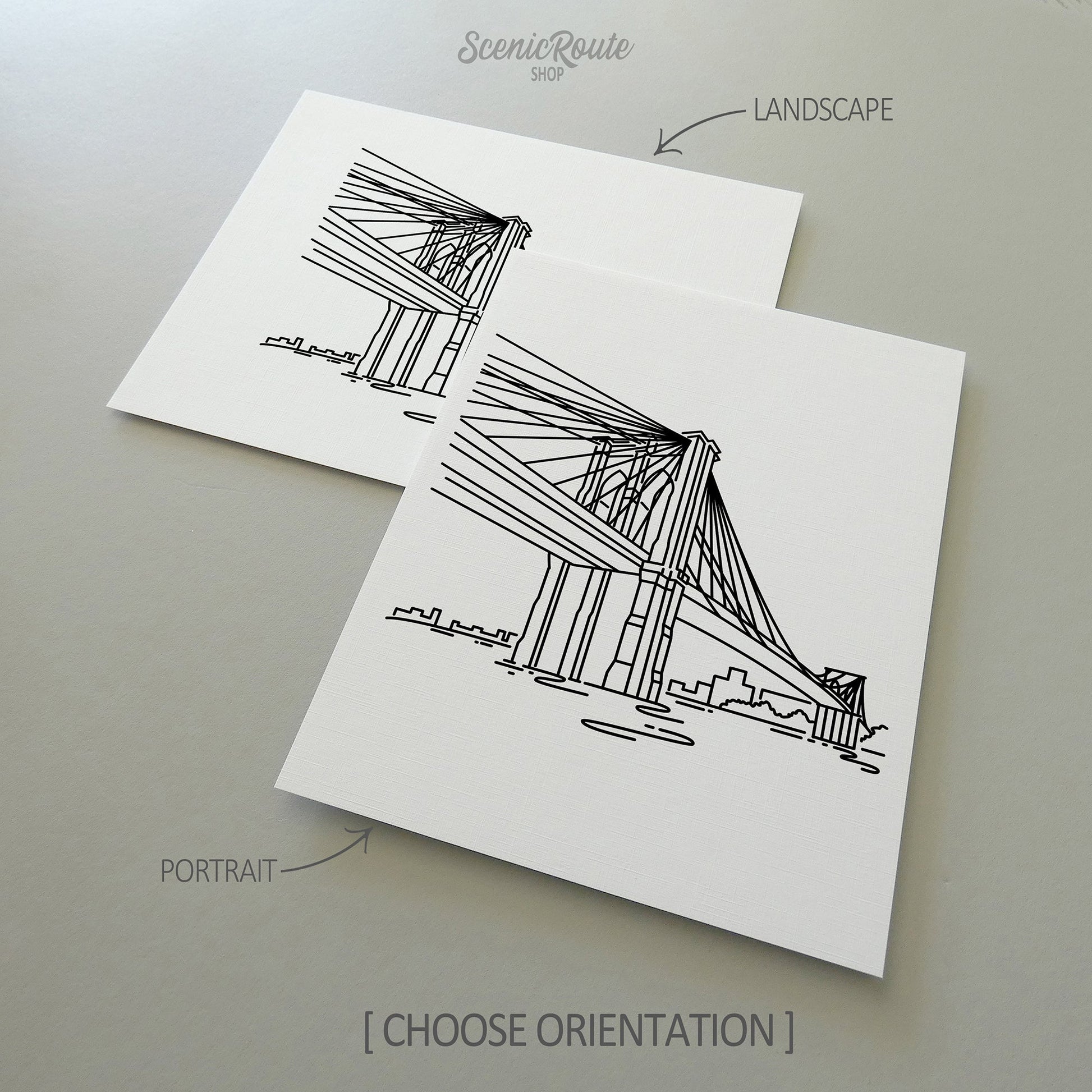 Two line art drawings of the Brooklyn Bridge on white linen paper with a gray background.  The pieces are shown in portrait and landscape orientation for the available art print options.