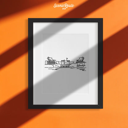 A framed line art drawing of the Steelers Stadium on an orange wall