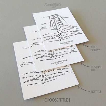 Three line art drawings of the Chapel of the Holy Cross in Sedona Arizona on white linen paper with a gray background.  The pieces are shown with title options that can be chosen and personalized.