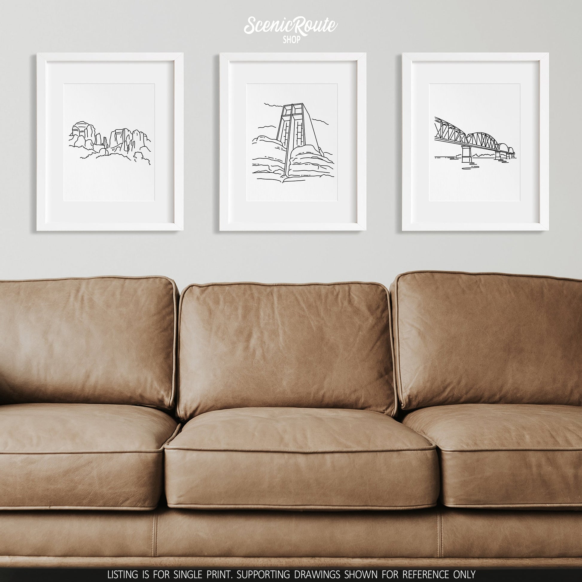 A group of three framed drawings on a wall above a couch. The line art drawings include Cathedral Rock, Chapel of the Holy Cross, and Big Four Bridge
