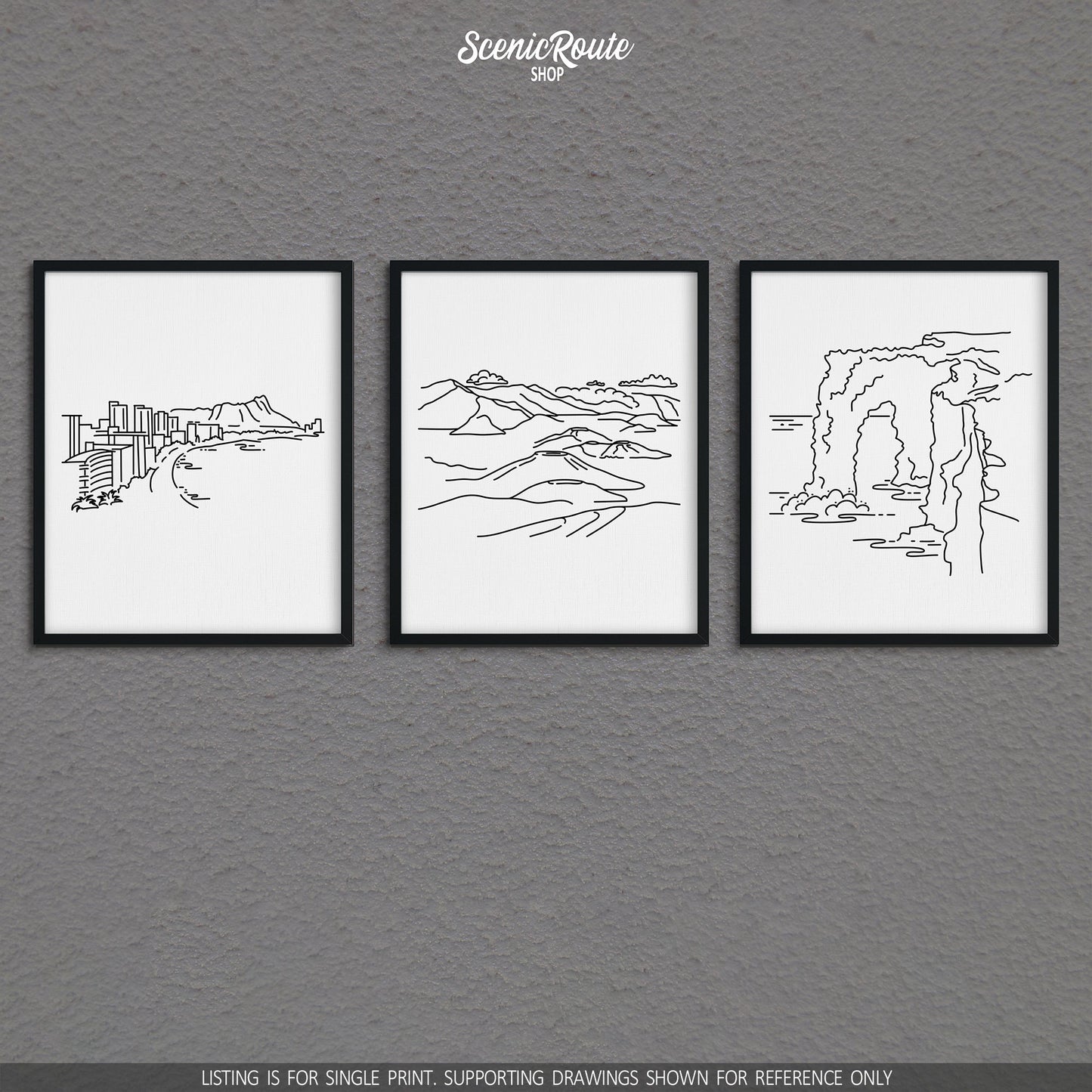 A group of three framed drawings on a gray wall. The line art drawings include the Honolulu Skyline, Haleakala National Park, and Hawaii Volcanoes National Park