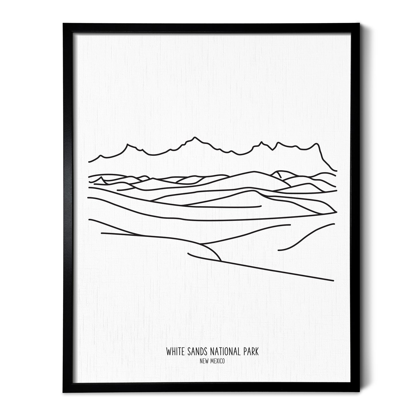 A line art drawing of White Sands National Park on white linen paper in a thin black picture frame